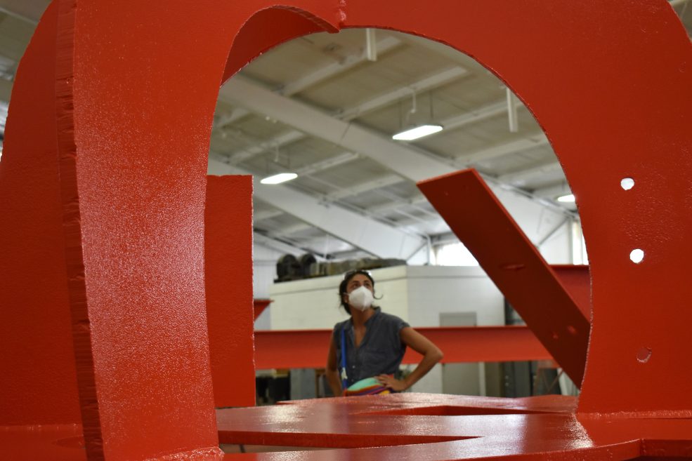 <em>Iroquois</em> paint restoration in August 2022 at the Color Works industrial paint facility in Delaware. Photo by Ashley Lippolis for the Association for Public Art.
