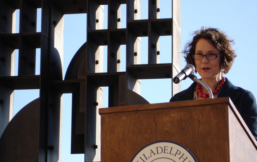 Maria Nevelson, granddaughter of artist Louise Nevelson, speaks at the rededication of her grandmother's sculpture "Atmosphere & Environment XII."