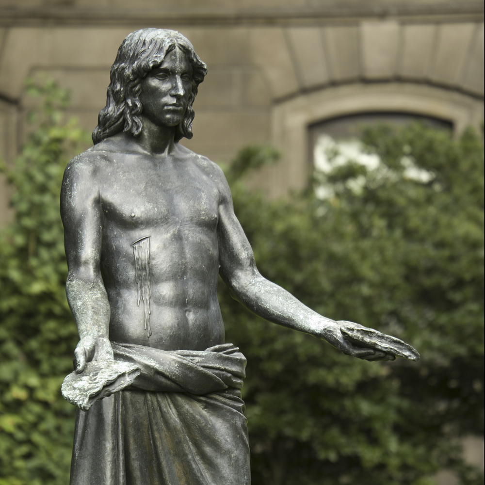 Bronze sculpture Jesus Breaking Bread by artist Walter Erlebacher