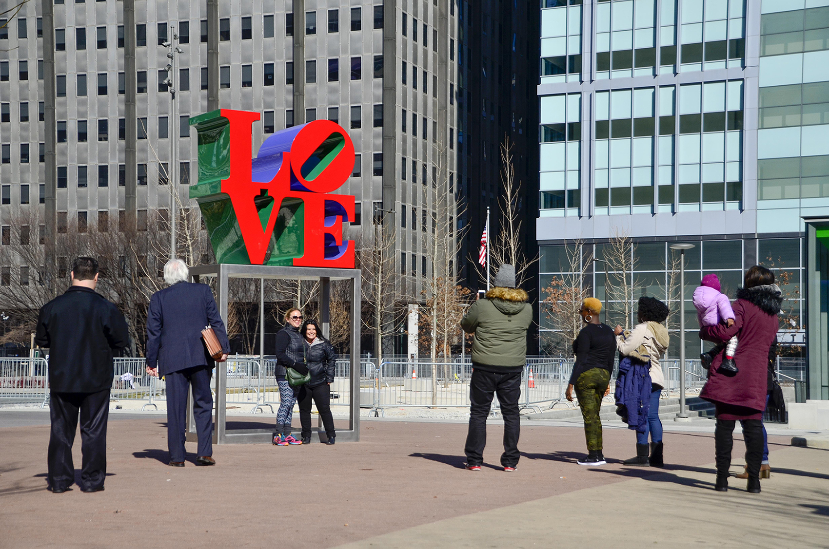 People taking pictures with newly restored LOVE sculpture