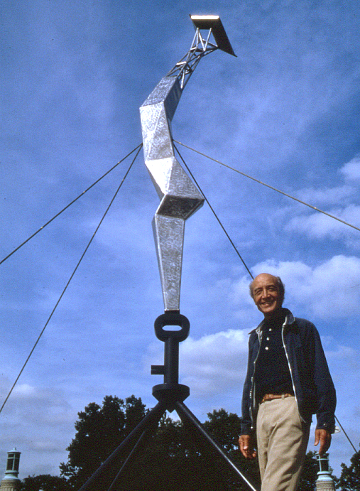 Artist Isamu Noguchi stands in front of his "Bolt of Lightning" sculpture