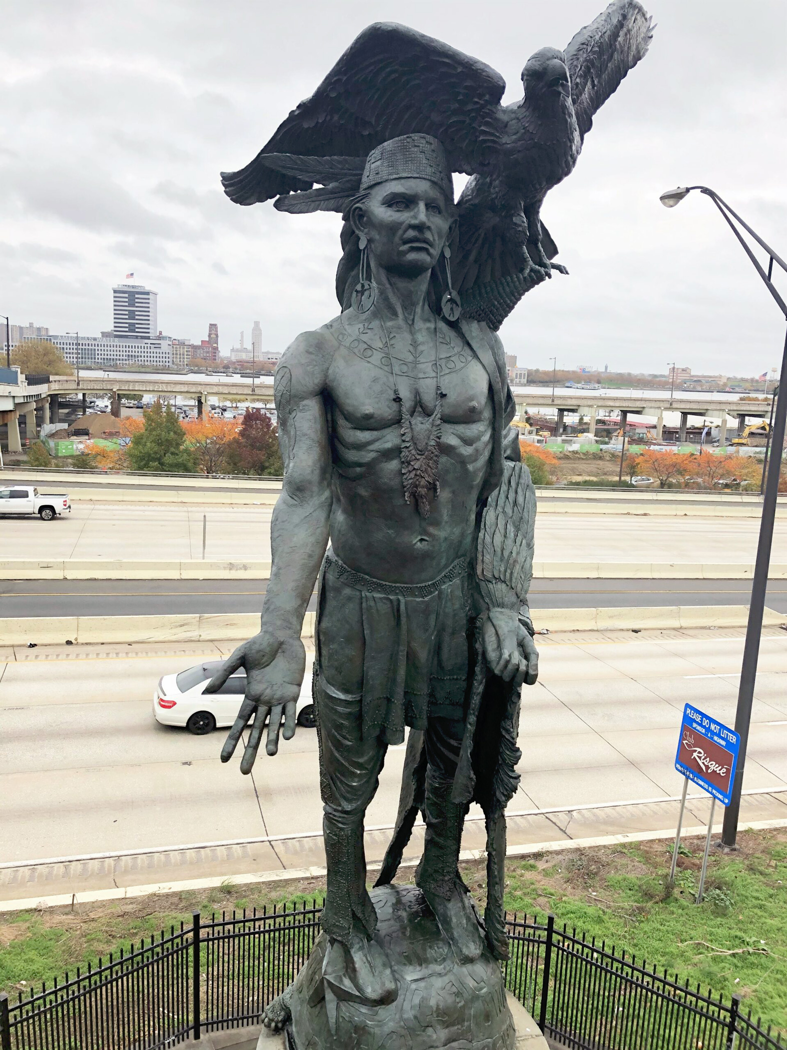 "Tamanend" Native American bronze sculpture in the city of Philadelphia after a recent conservation treatment. Figure has one arm outstretched with a bird on his shoulder and he stands on a turtle.