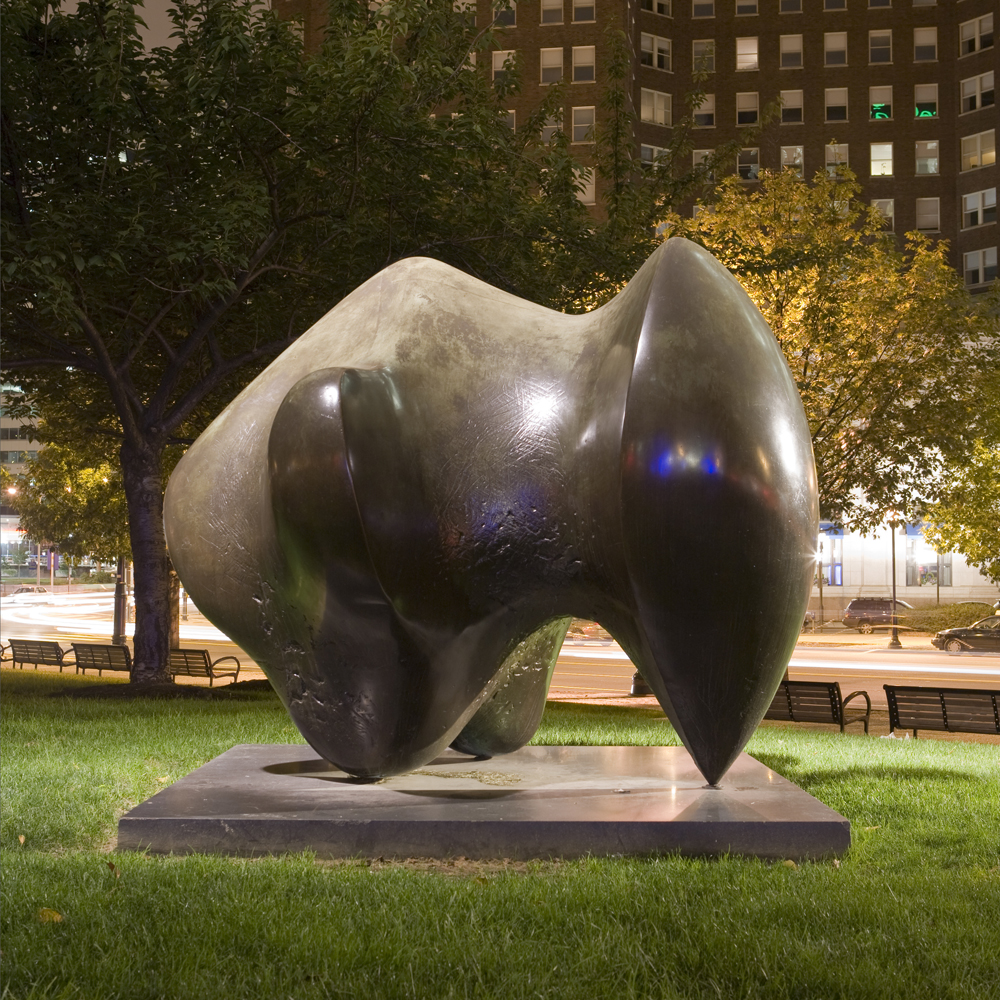Henry Moore's sculpture, Three-Way Piece Number 1: Points, illuminated at night