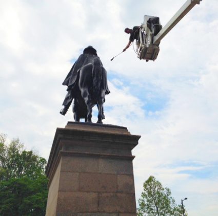 General Grant Conservation. Conservator shown in a lift above the sculpture.