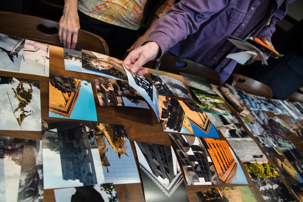 Printed photo submissions at the <em>Public Art in Focus</em> closing event, hosted at Park Towne Place Museum District Residences. Photo by Johanna Austin, www.AustinArt.org.