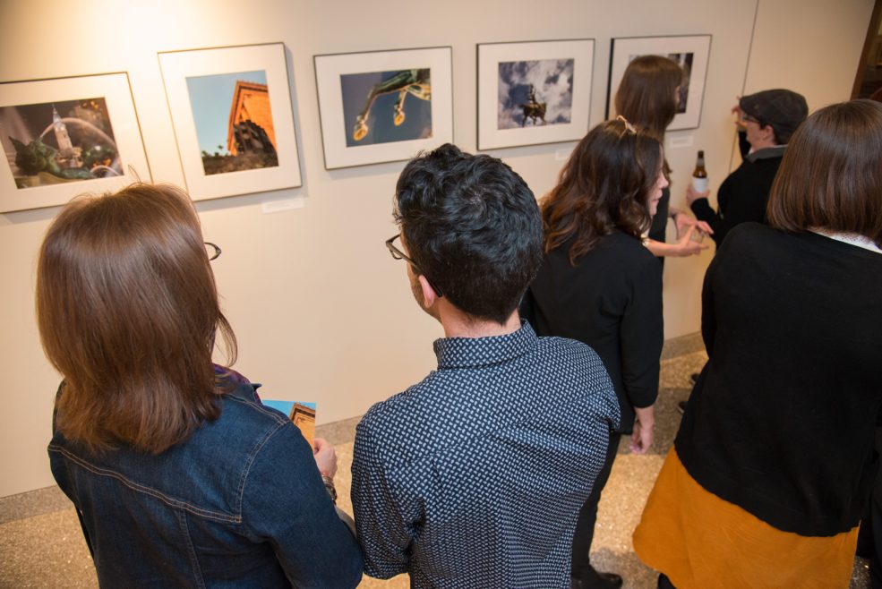Winning photos on display at the <em>Public Art in Focus</em> closing event, hosted at Park Towne Place Museum District Residences. Photo by Johanna Austin, www.AustinArt.org.