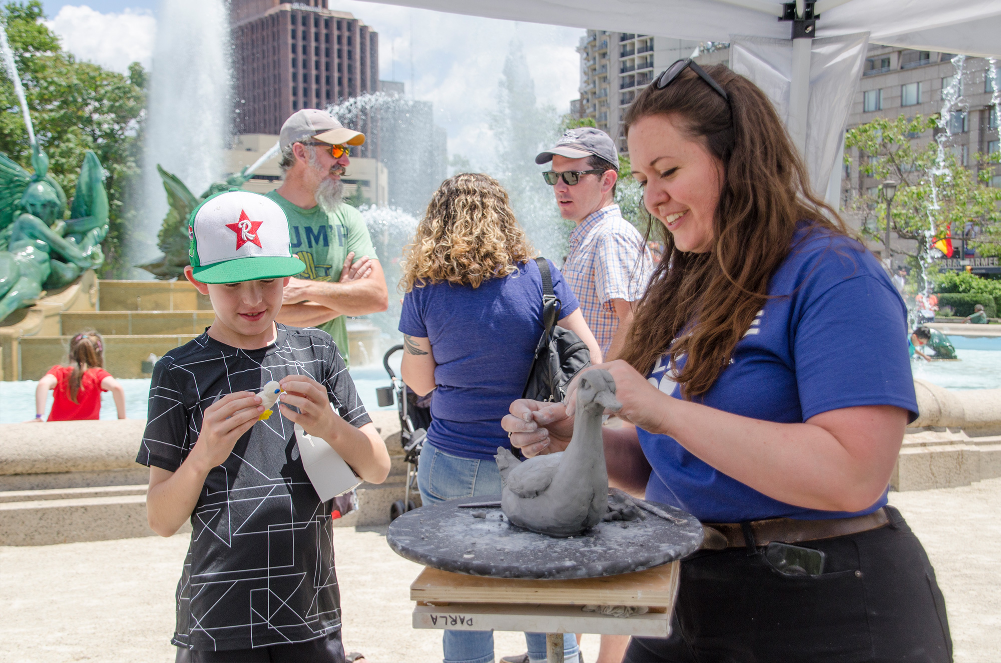 Sculpture Zoo in Logan Circle event - sculptor making sculpture of a duck