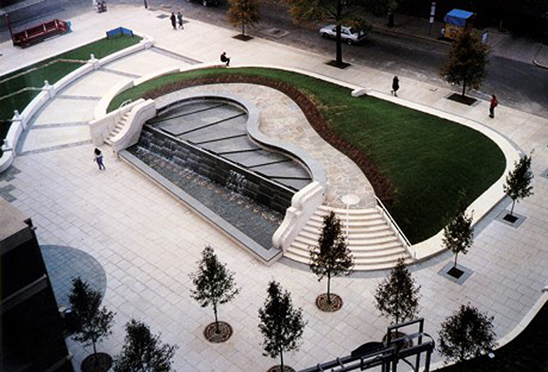 aerial view of The Roundabout showing tree plantings, a grass mound, water feature, and pathways