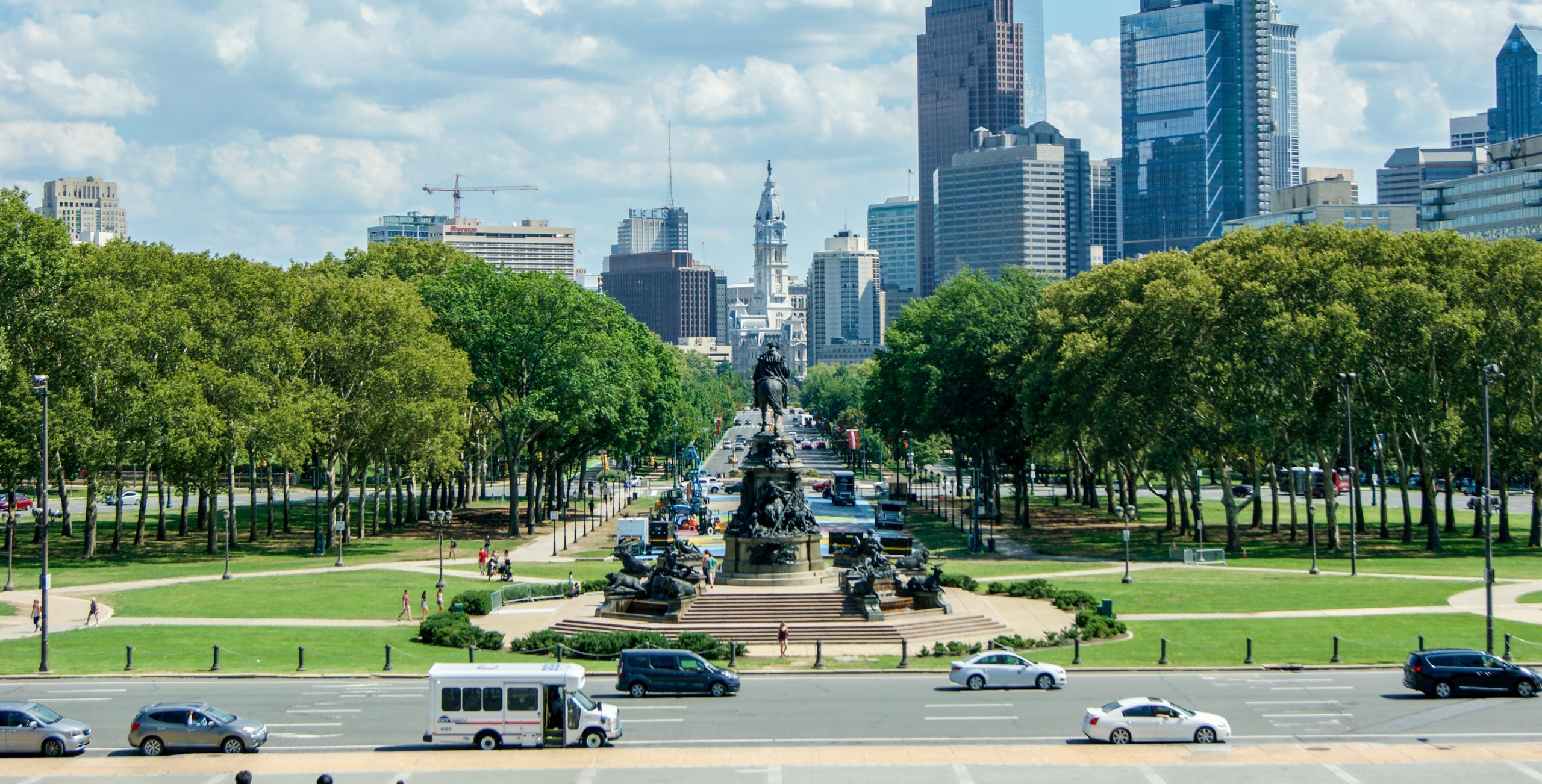 Looking down the Benjamin Franklin Parkway towards the Philadelphia cityscape from the Philadelphia Museum of Art on a summer day. 