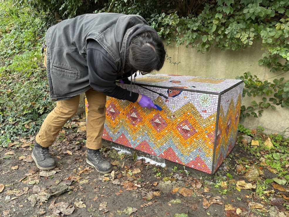 Conservation of Diane Pieri's mosaic <em>Manayunk Stoops</em> following Hurricane Ida in 2021. Photo © Caitlin Martin for the Association for Public Art.