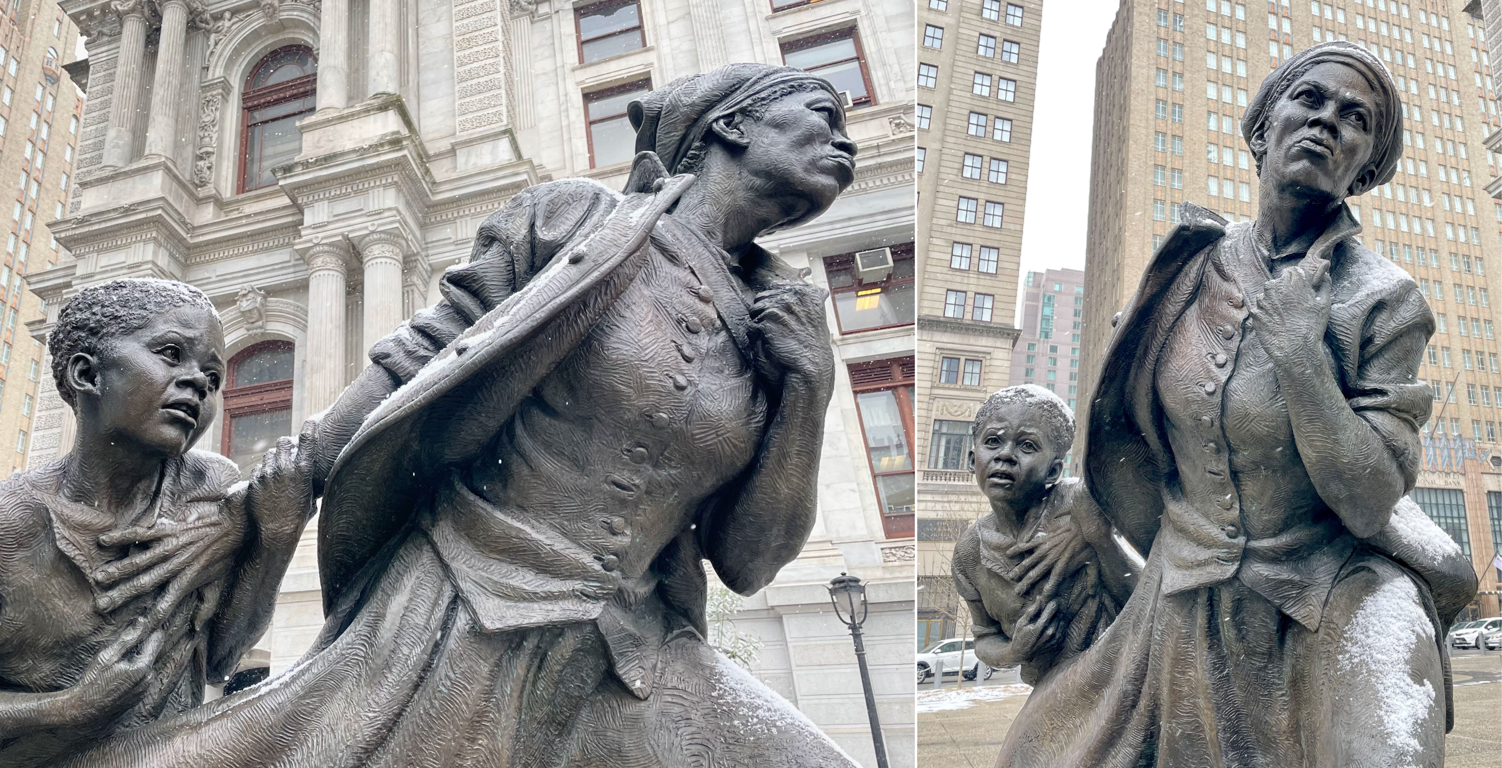 A bronze sculpture of a determined Harriet Tubman helping a young boy in front of Philadelphia's City Hall. It's a grey and wintery day in the city.
