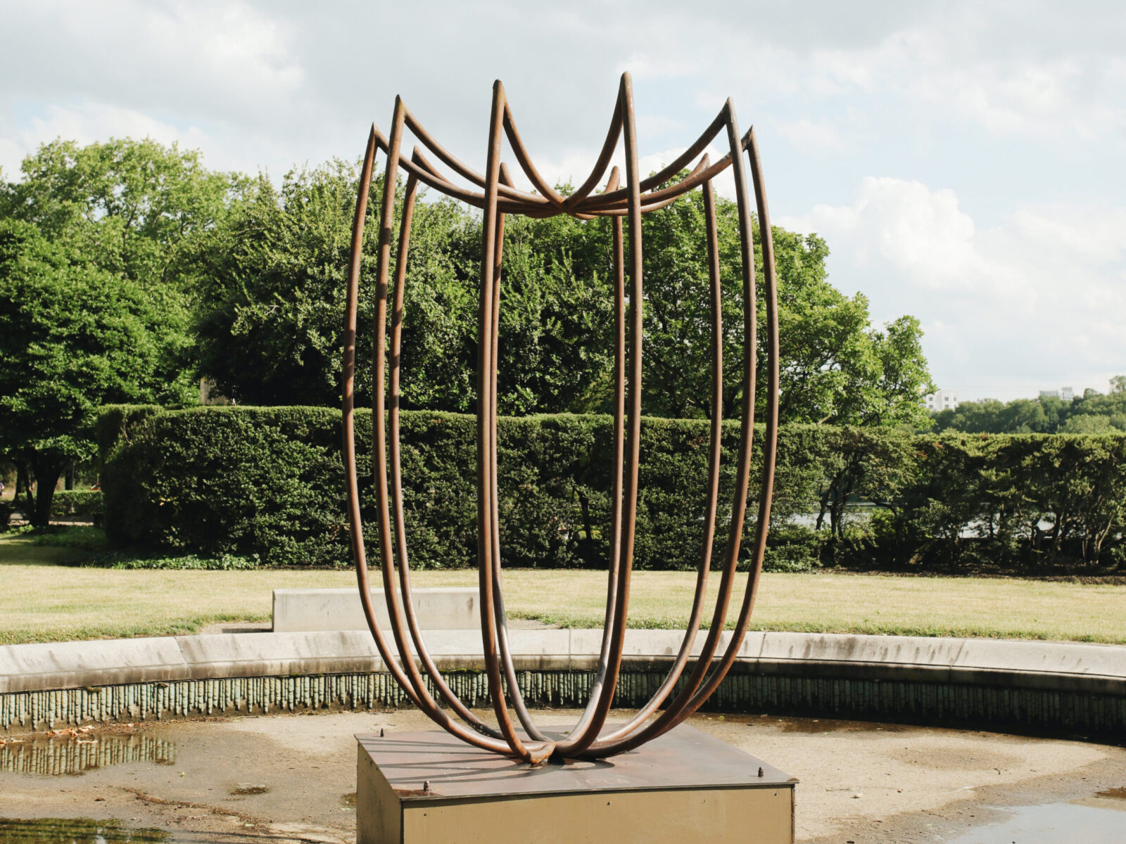 One of ten large-scale open metal vessel sculptures by Maren Hassinger, installed at the Ellen Phillips Samuel Memorial in Philadelphia, along Kelly Drive and the Schuylkill River. Inspired by ancient iconic vessel archetypes, the abstract sculptures suggest three-dimensional line drawings that vividly connect art with nature.