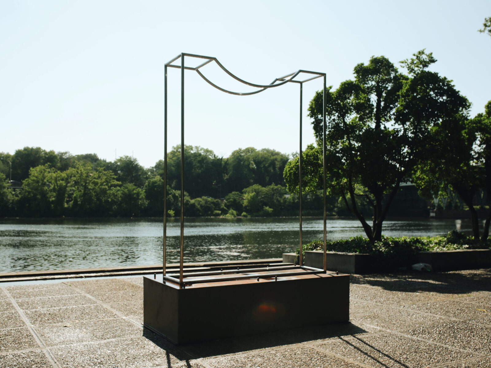 One of ten large-scale open metal vessel sculptures by Maren Hassinger, installed at the Ellen Phillips Samuel Memorial in Philadelphia, along Kelly Drive and the Schuylkill River. Inspired by ancient iconic vessel archetypes, the abstract sculptures suggest three-dimensional line drawings that vividly connect art with nature.