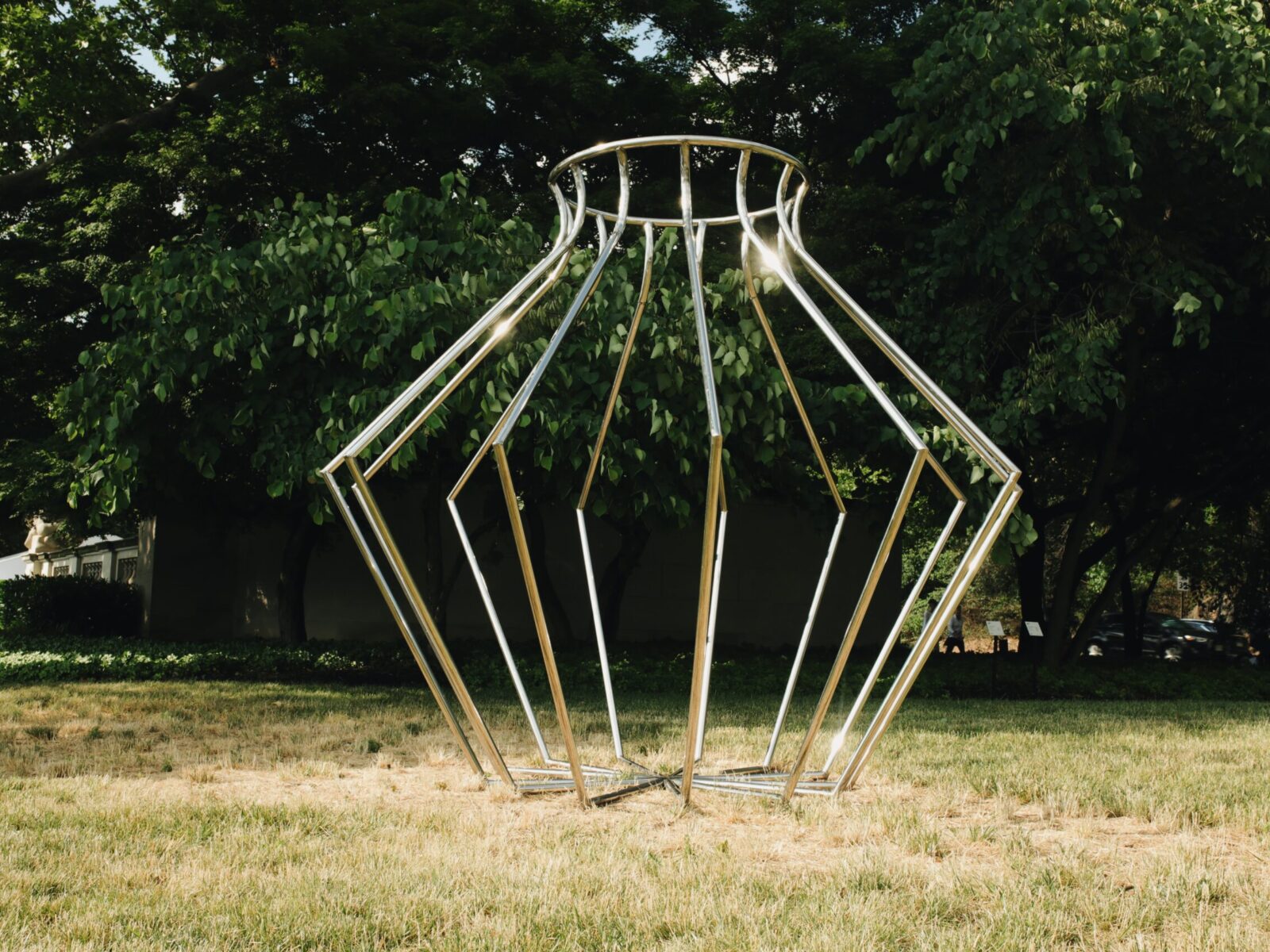 One of ten large-scale open metal vessel sculptures by Maren Hassinger, installed at the Ellen Phillips Samuel Memorial in Philadelphia, along Kelly Drive and the Schuylkill River. Inspired by ancient iconic vessel archetypes, the abstract sculptures suggest three-dimensional line drawings that vividly connect art with nature.