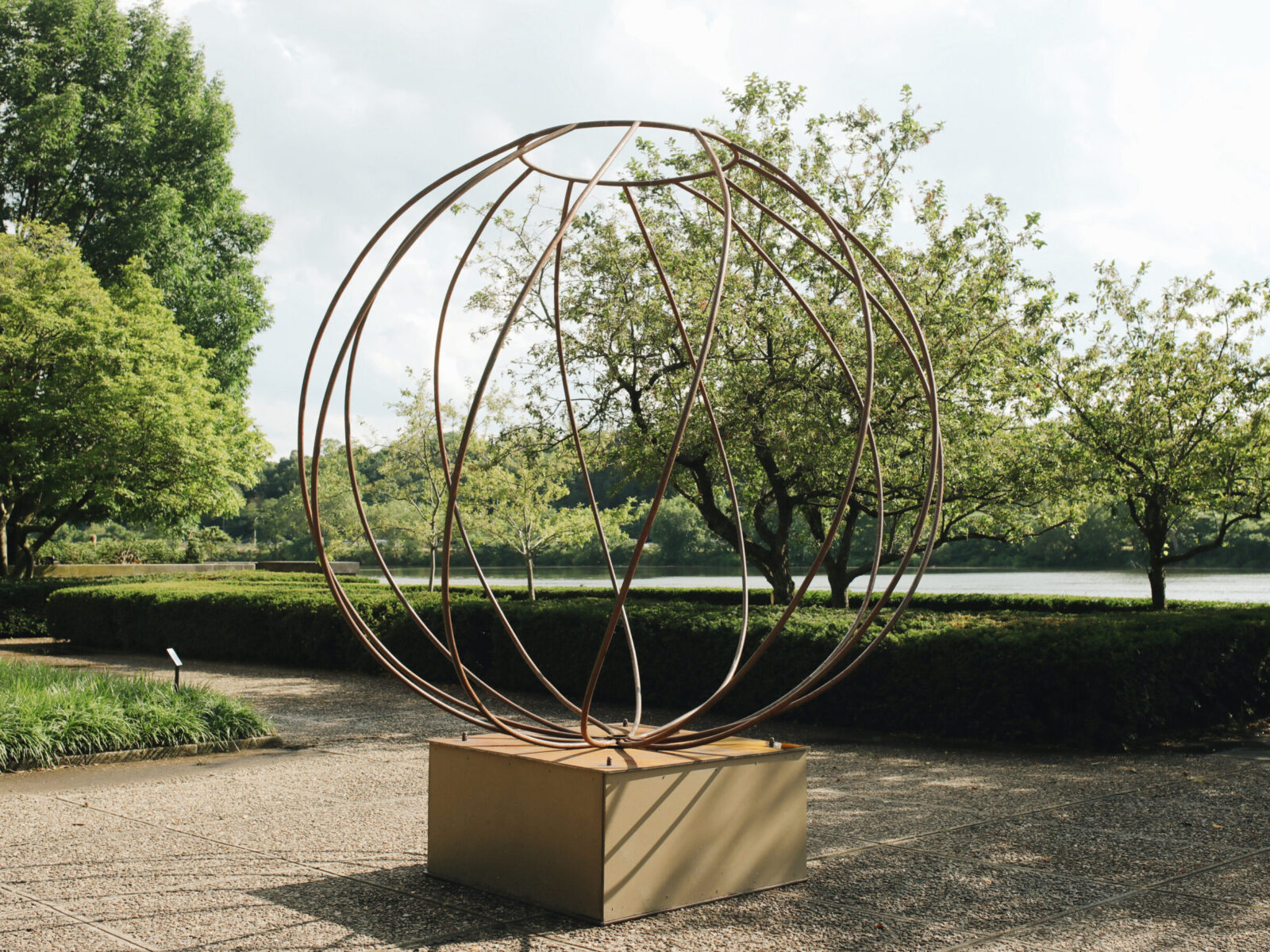 One of ten large-scale open metal vessel sculptures by Maren Hassinger, installed at the Ellen Phillips Samuel Memorial in Philadelphia, along Kelly Drive and the Schuylkill River. Inspired by ancient iconic vessel archetypes, the abstract sculptures suggest three-dimensional line drawings that vividly connect art with nature.