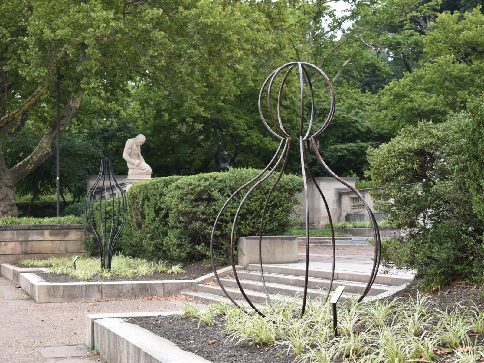 One of ten large-scale open metal vessel sculptures by Maren Hassinger, installed at the Ellen Phillips Samuel Memorial in Philadelphia, along Kelly Drive and the Schuylkill River. Inspired by ancient iconic vessel archetypes, the abstract sculptures suggest three-dimensional line drawings that vividly connect art with nature.